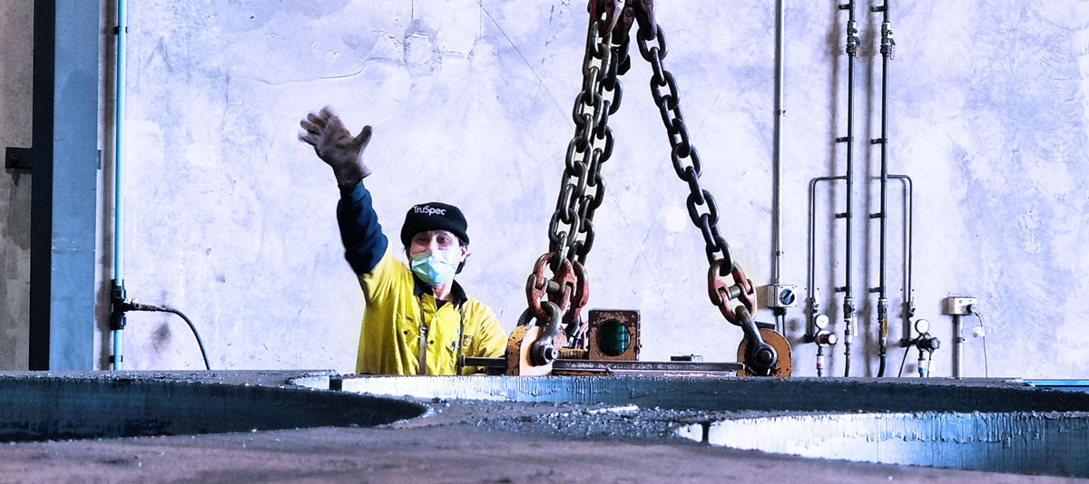 Waving Shapecut employee happily wearing a mask to stay healthy