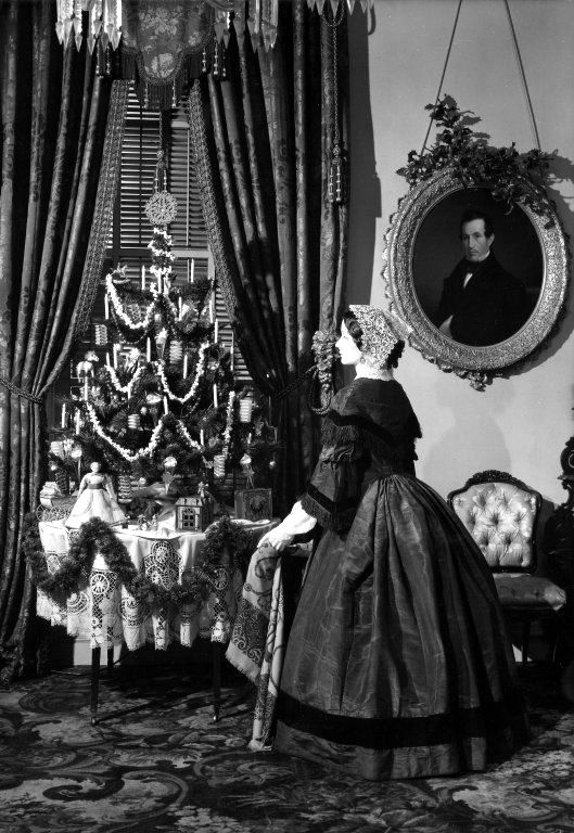 Back in the 1860s, black and white photos depict tinsel hanging - which may have been copper, tin or silk and foil